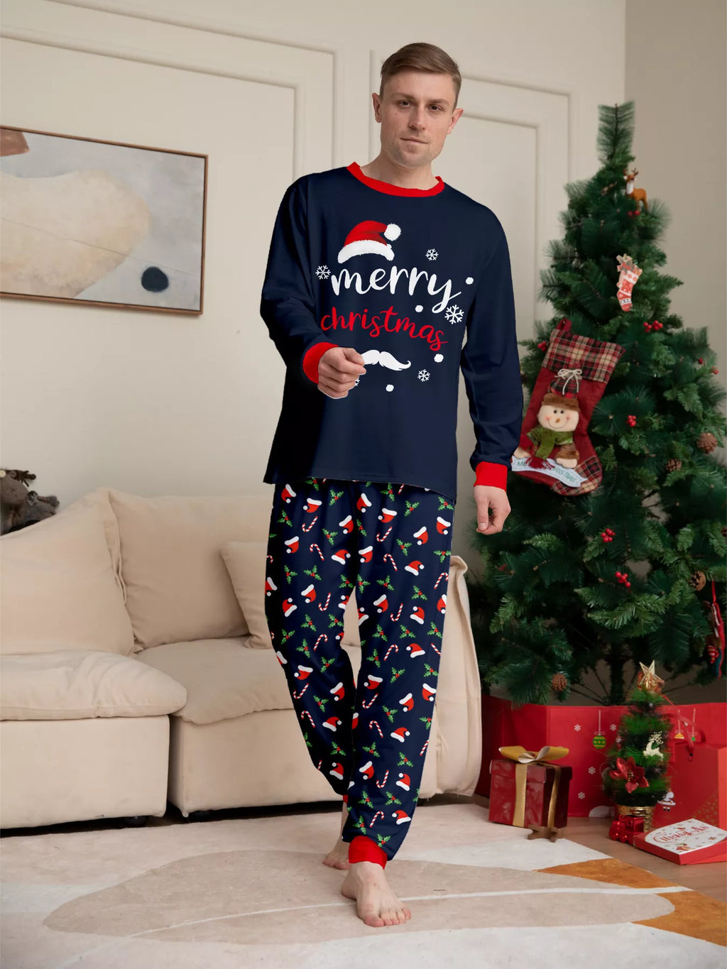 Front view of the men's navy Christmas graphic pajamas.
