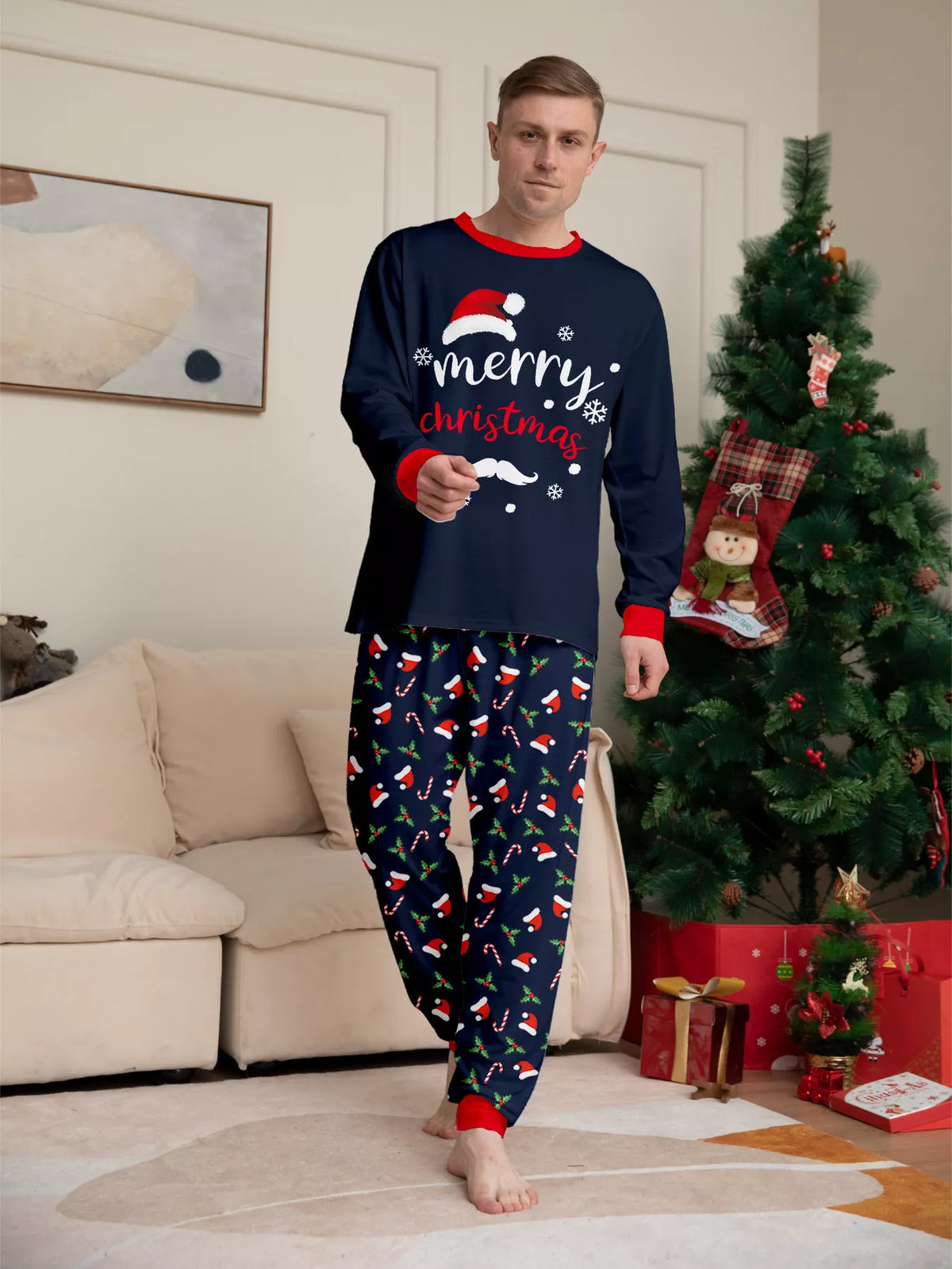 Front view of the men's navy Christmas graphic pajamas.