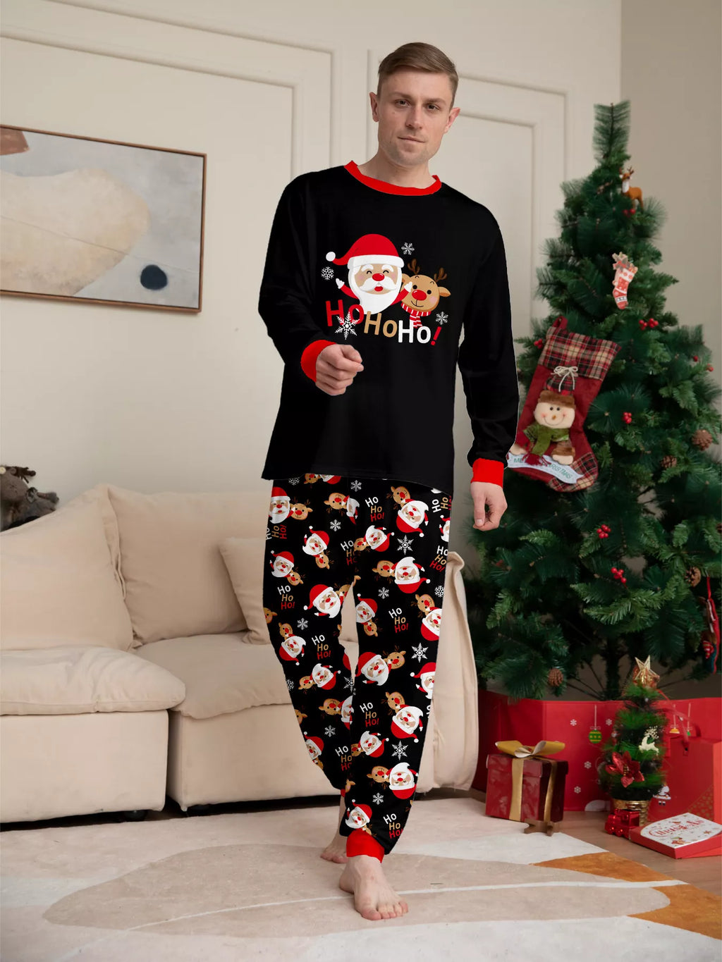 Front view of the men's black Ho Ho Ho Santa graphic pajamas.