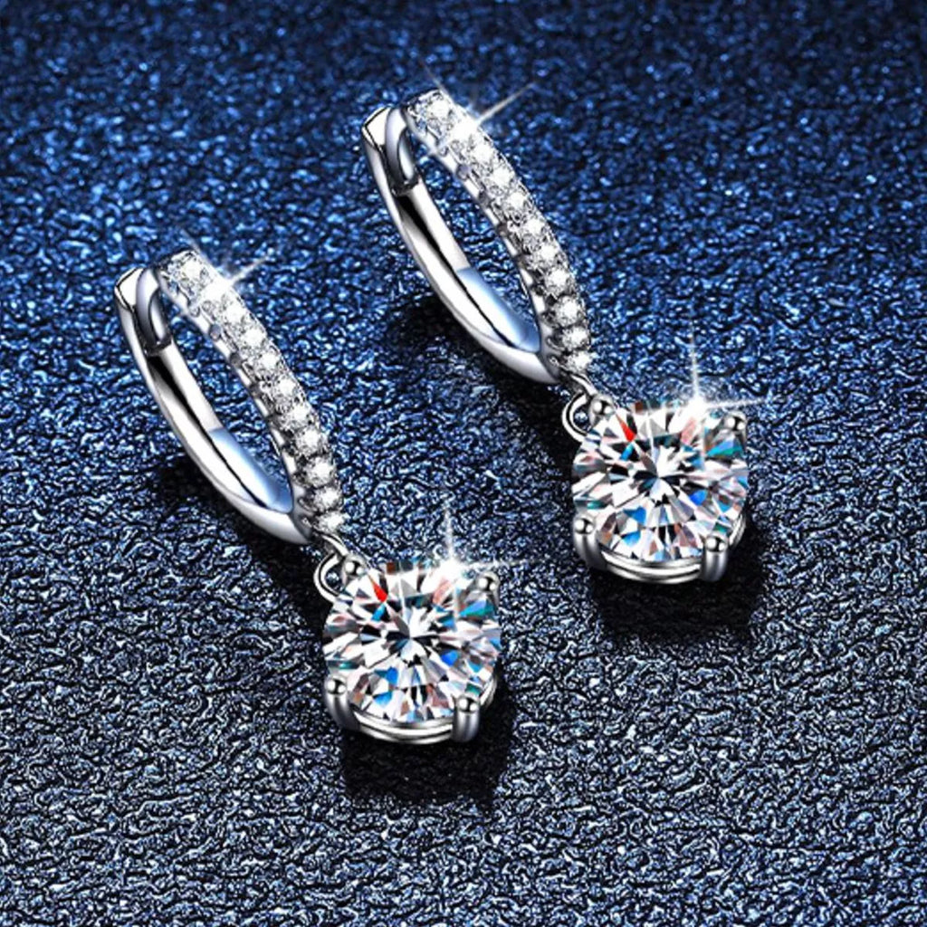 Silver-tone hoop earrings with round halo stone drops — detail view