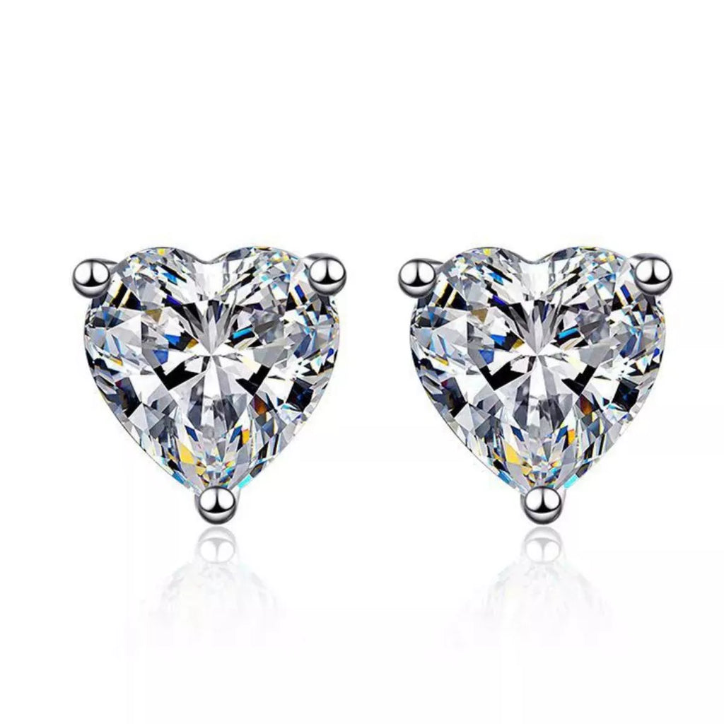 Silver-tone heart-shaped clear stone stud earrings — detail view