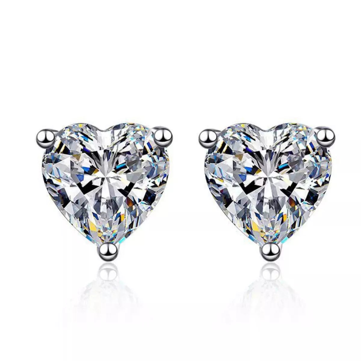 Silver-tone heart-shaped clear stone stud earrings — detail view