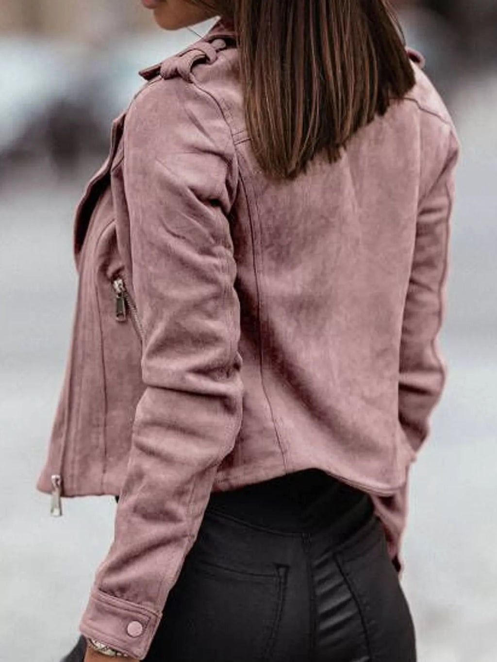 Back view of the pink asymmetrical-zip jacket.