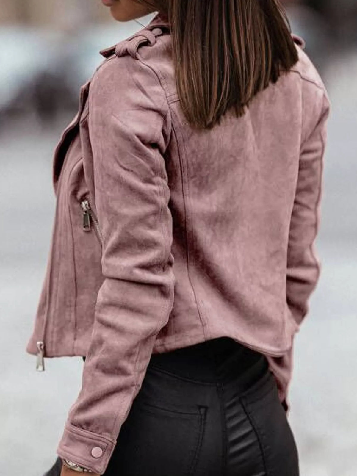 Back view of the pink asymmetrical-zip jacket.