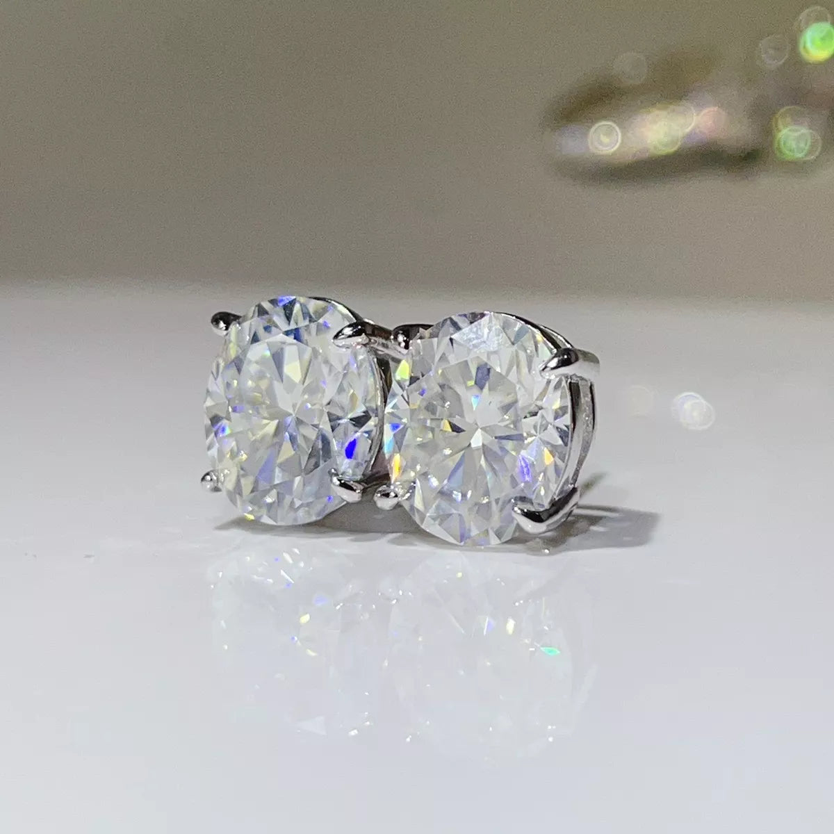 Silver-tone round clear stone stud earrings — detail view