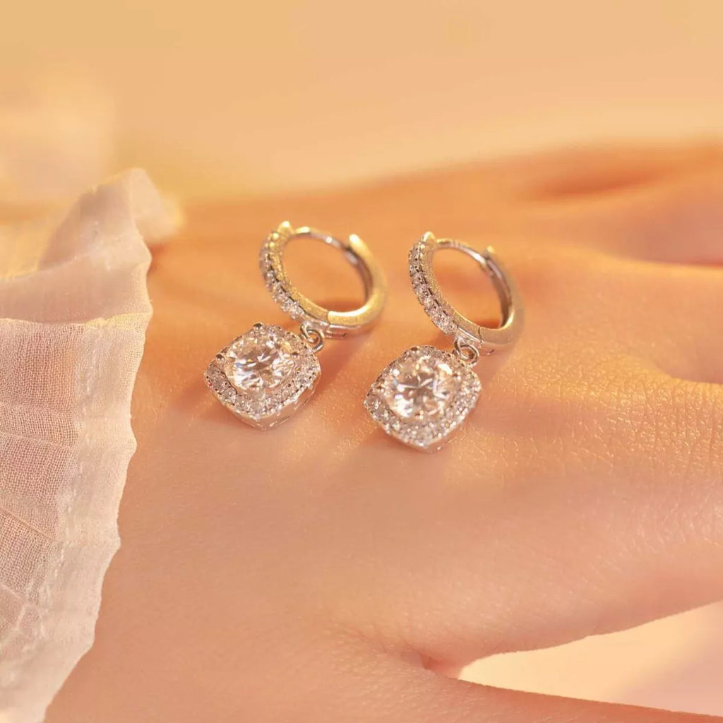 Silver-tone hoop earrings with square halo stone drops — detail view