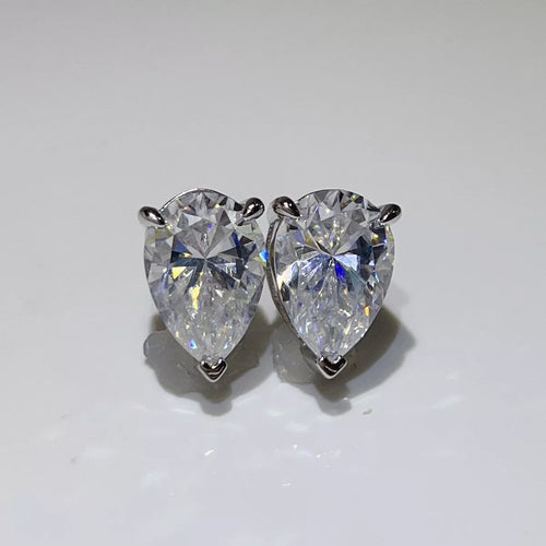 Silver-tone stud earrings with triangular clear stones — detail view