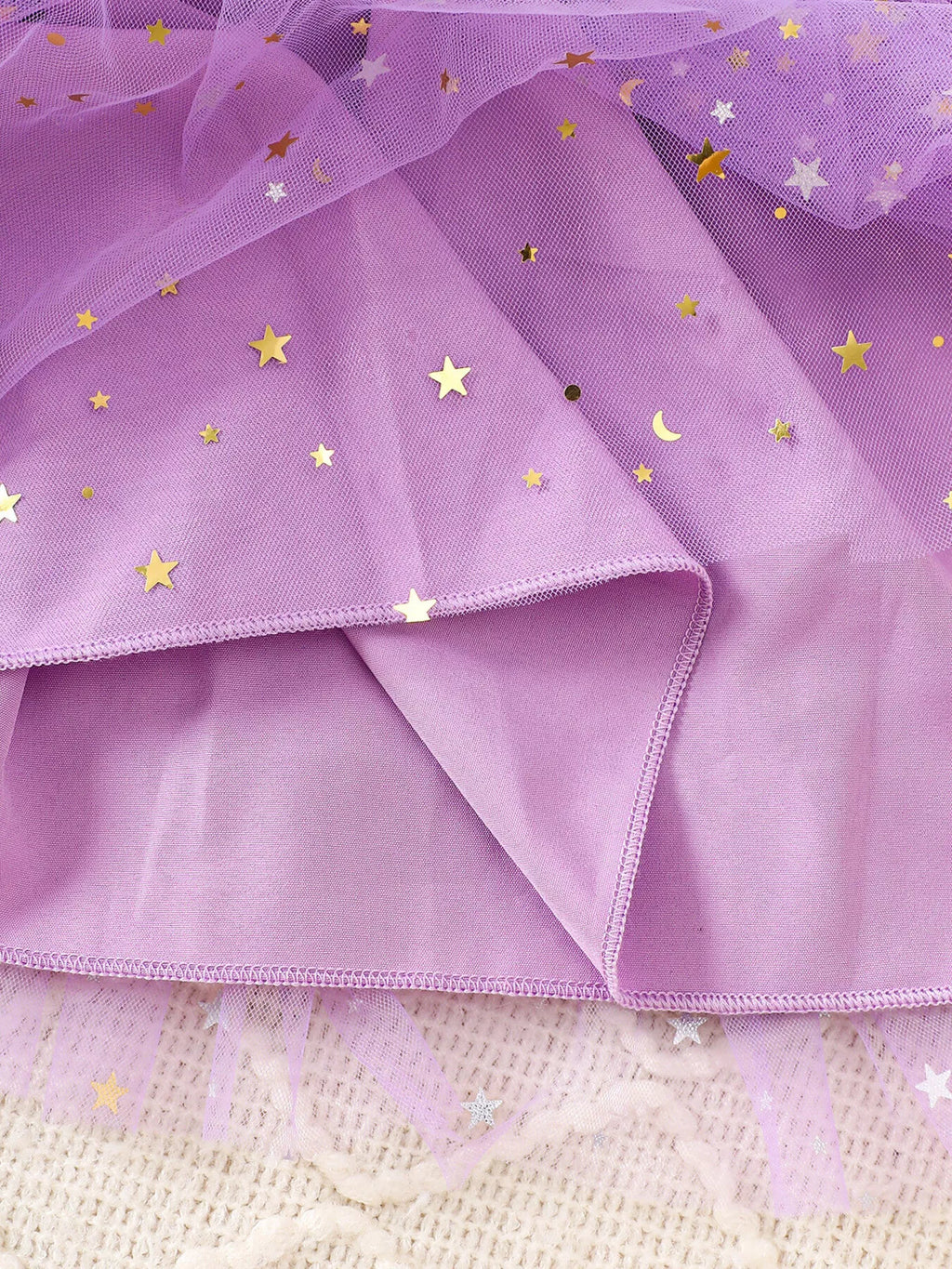 Close-up of the purple tulle skirt and solid purple lining.