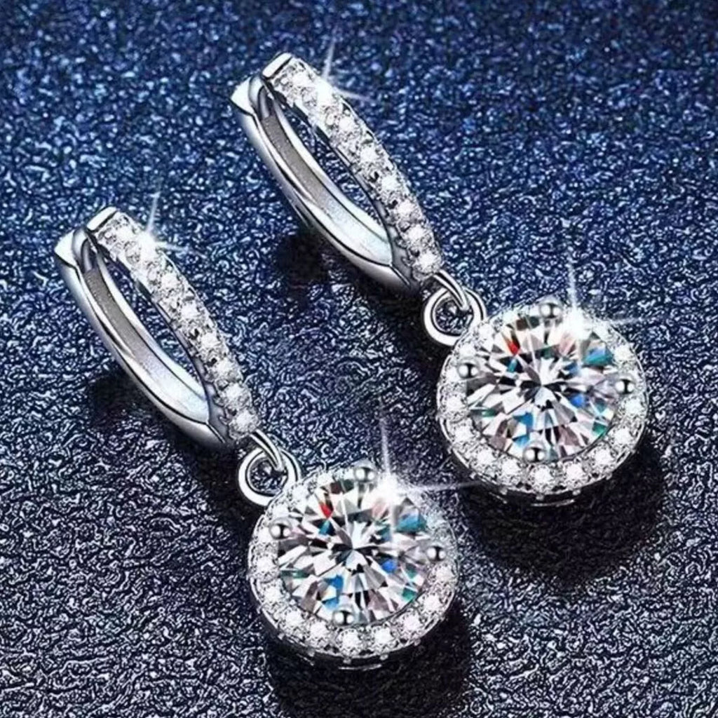 Silver-tone hoop earrings with round halo stone drops — detail view