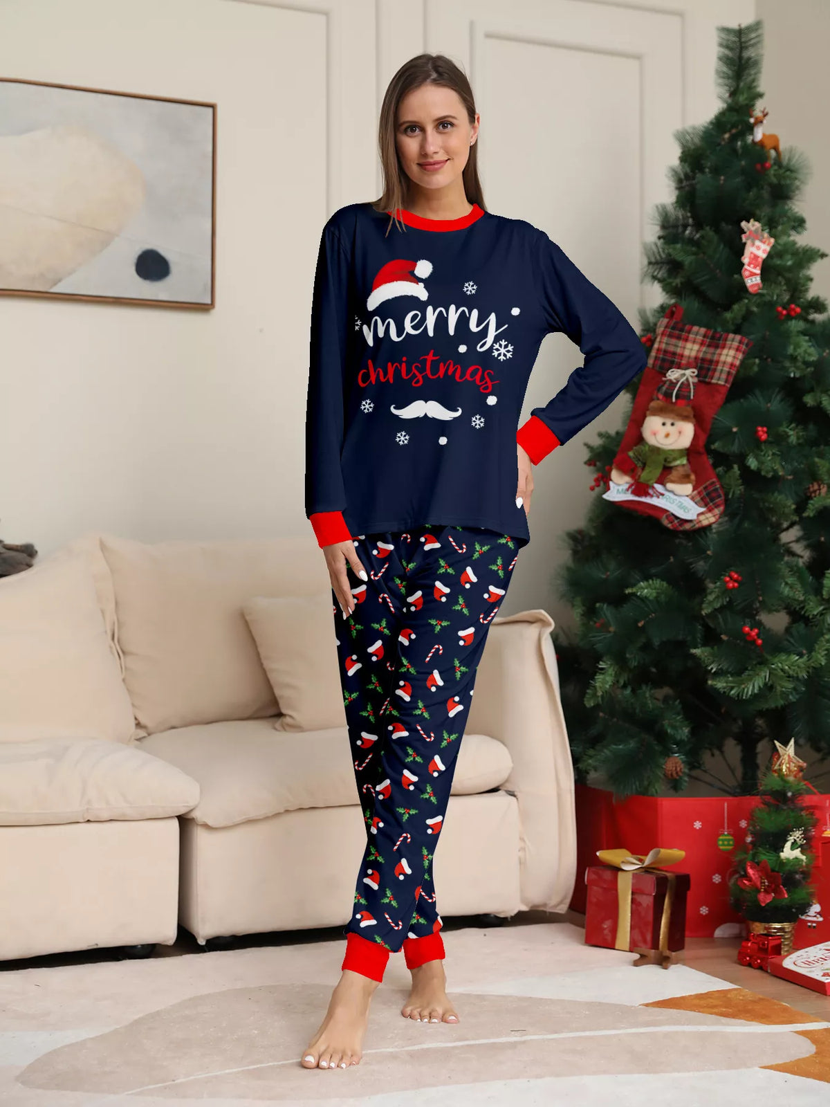 Front view of the women's navy Christmas graphic pajamas.