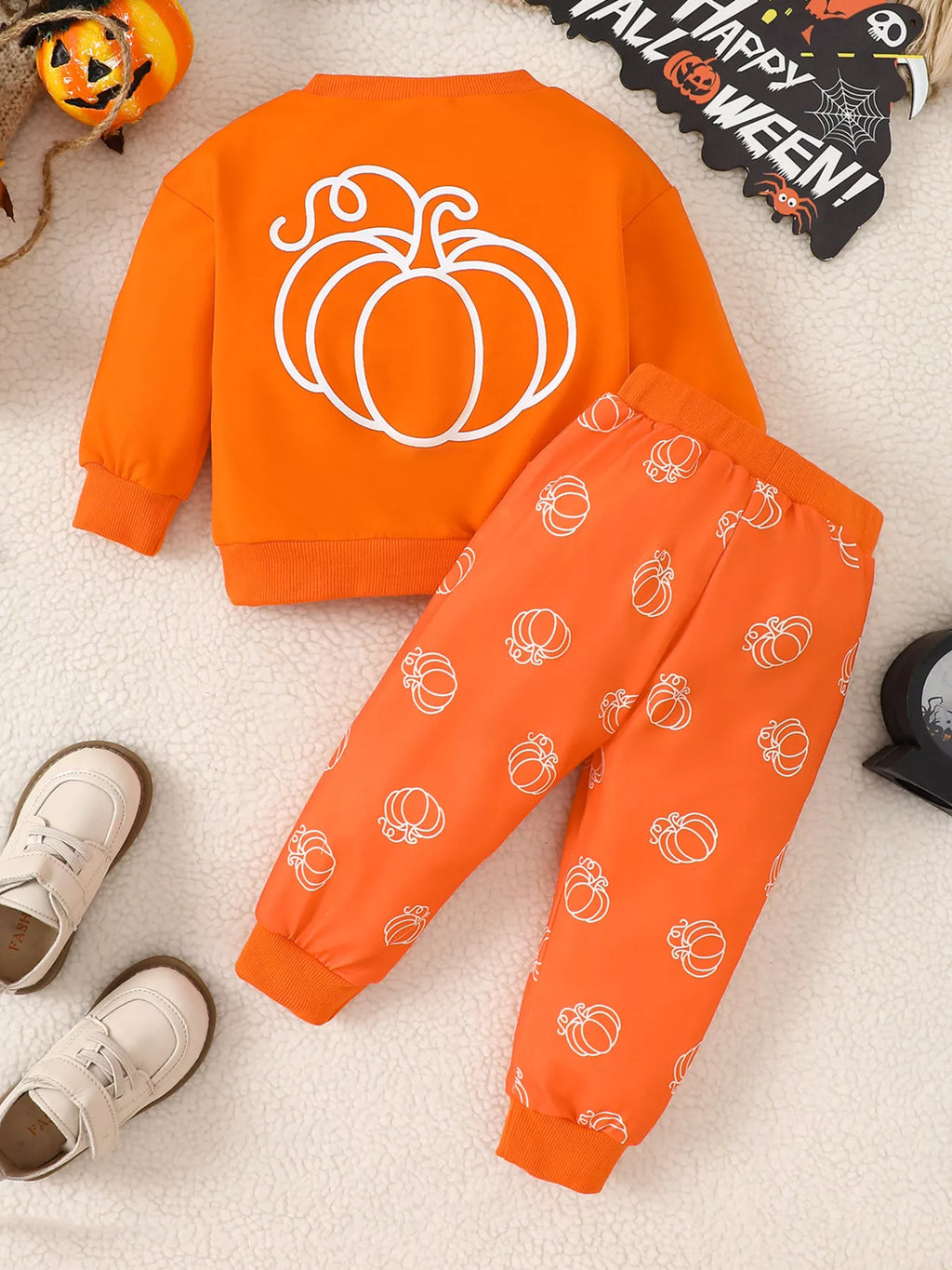 Orange pumpkin-print sweatshirt and matching drawstring pants — back view