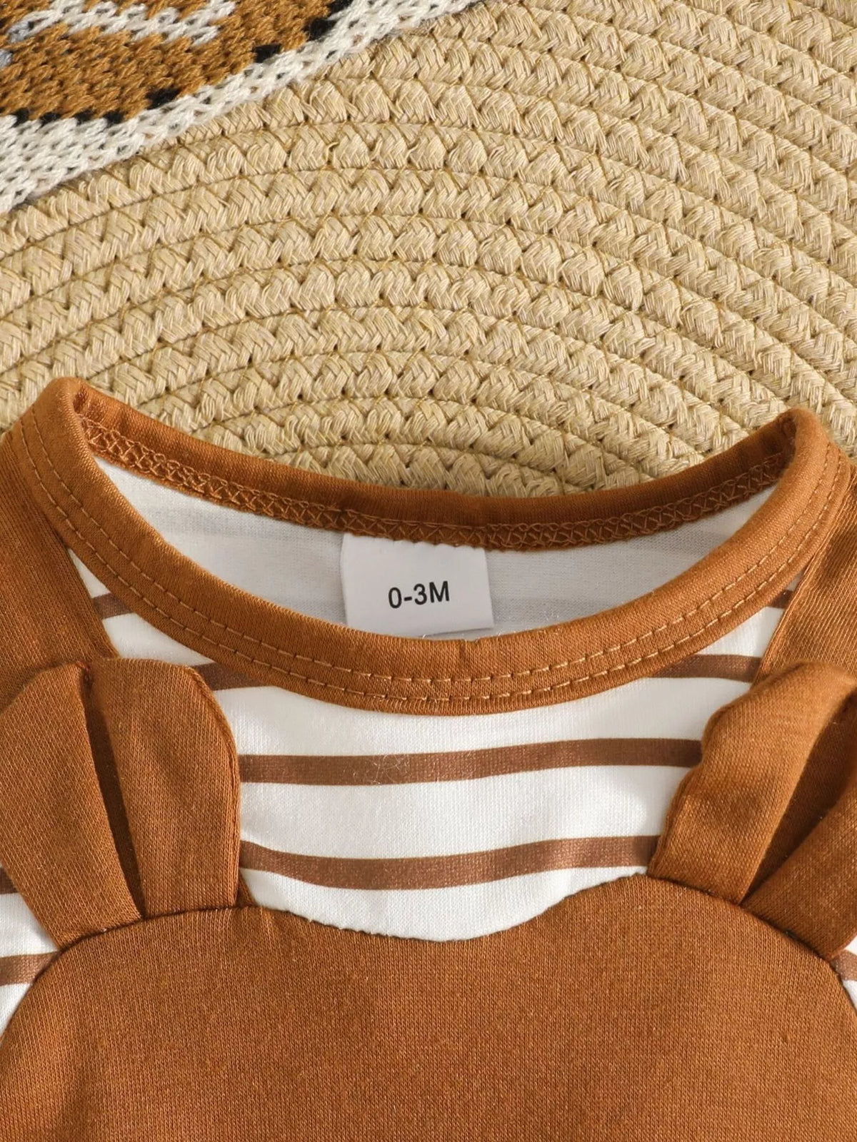 Striped neckline and straps of the brown bear-print baby outfit