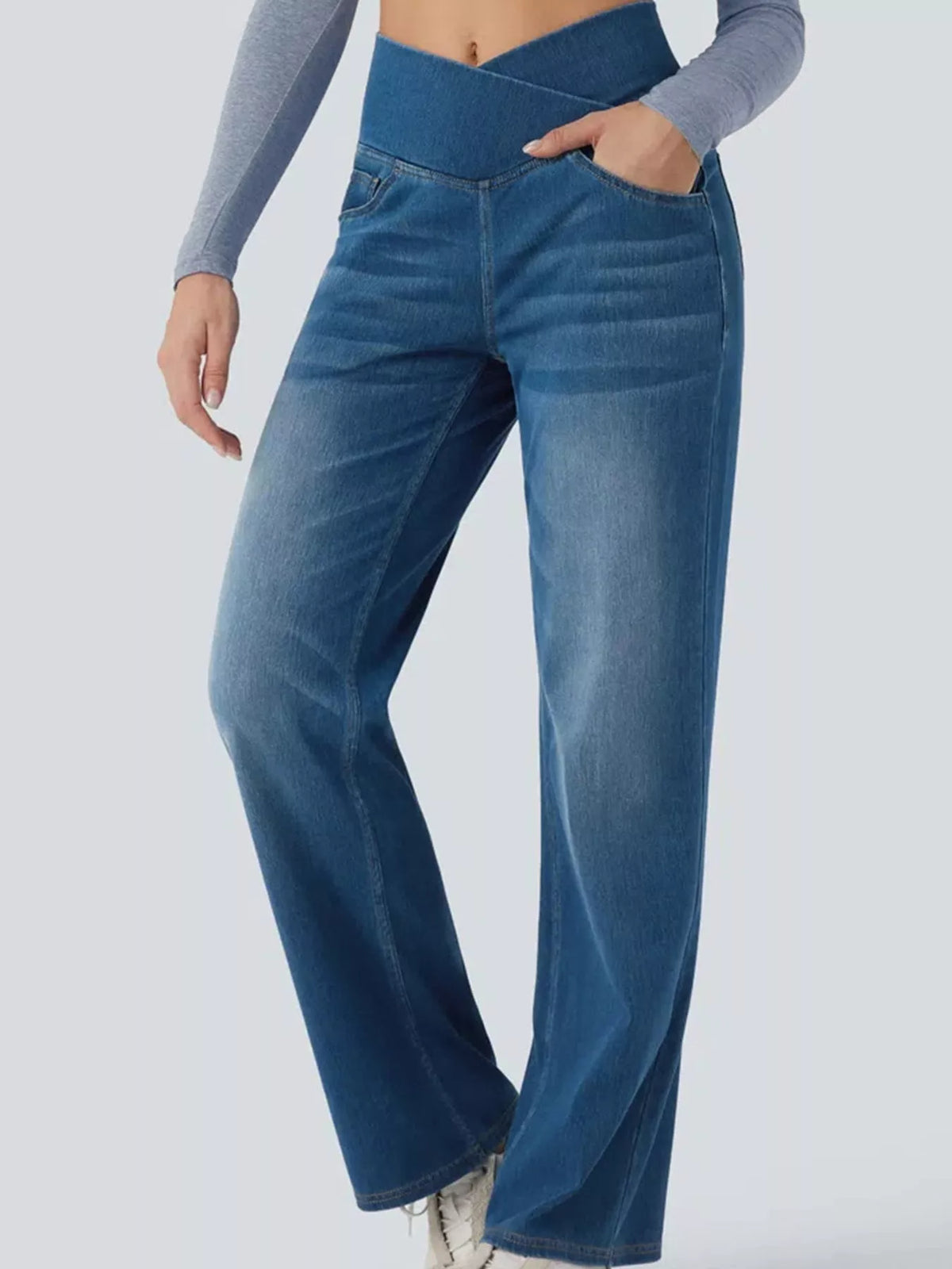 Light blue high-waisted crossover waistband straight-leg jeans — detail view