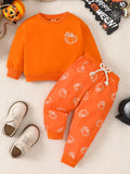 Orange pumpkin-print sweatshirt and matching drawstring pants displayed flat