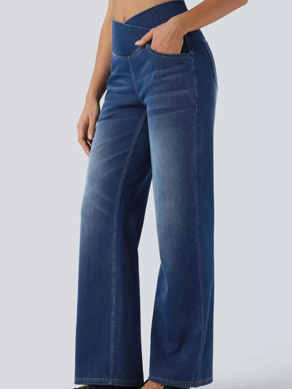 Dark blue high-waisted crossover waistband straight-leg jeans — detail view