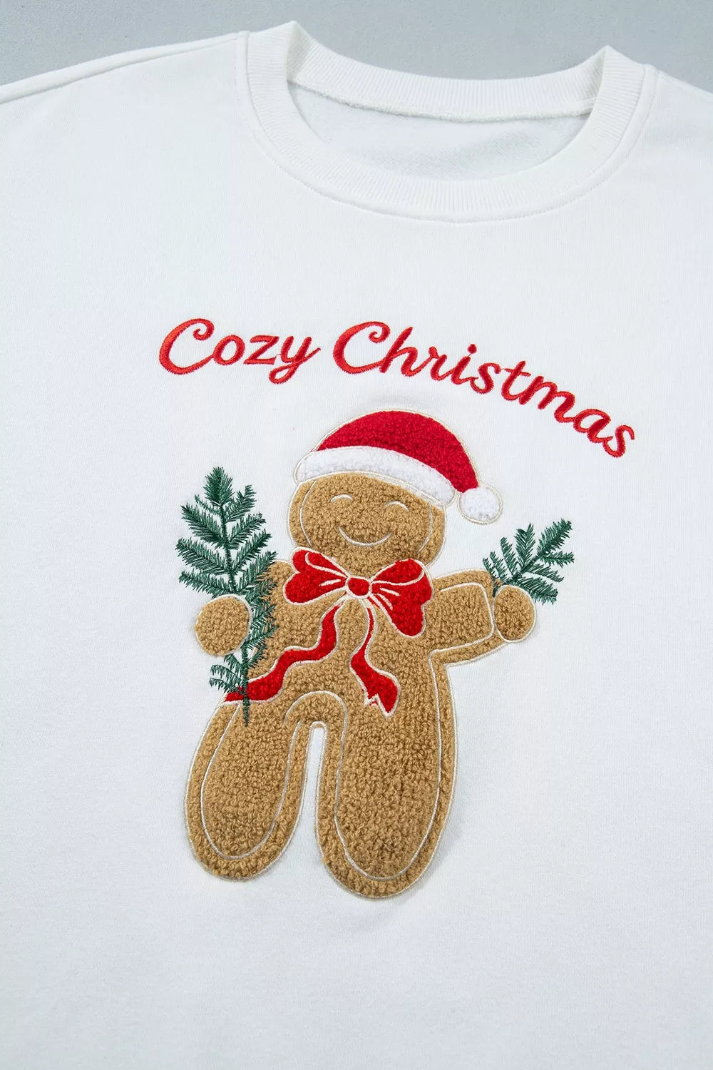 White embroidered Gingerbread Cozy Christmas Long Sleeve Round Neck Sweatshirt — detail view