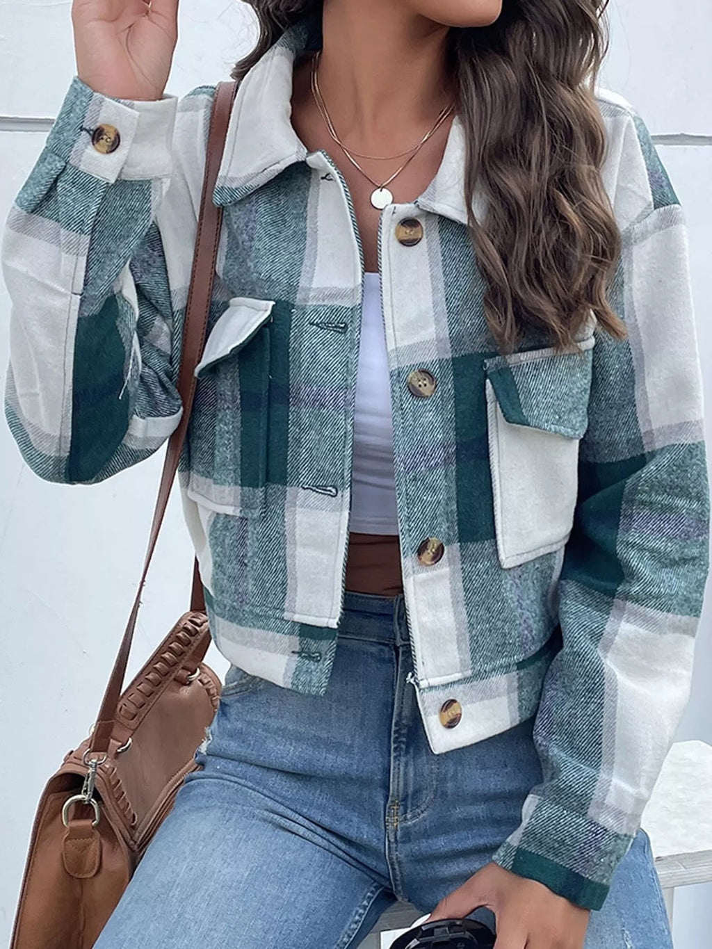 Green color-block plaid cropped jacket with flap chest pockets, front view.