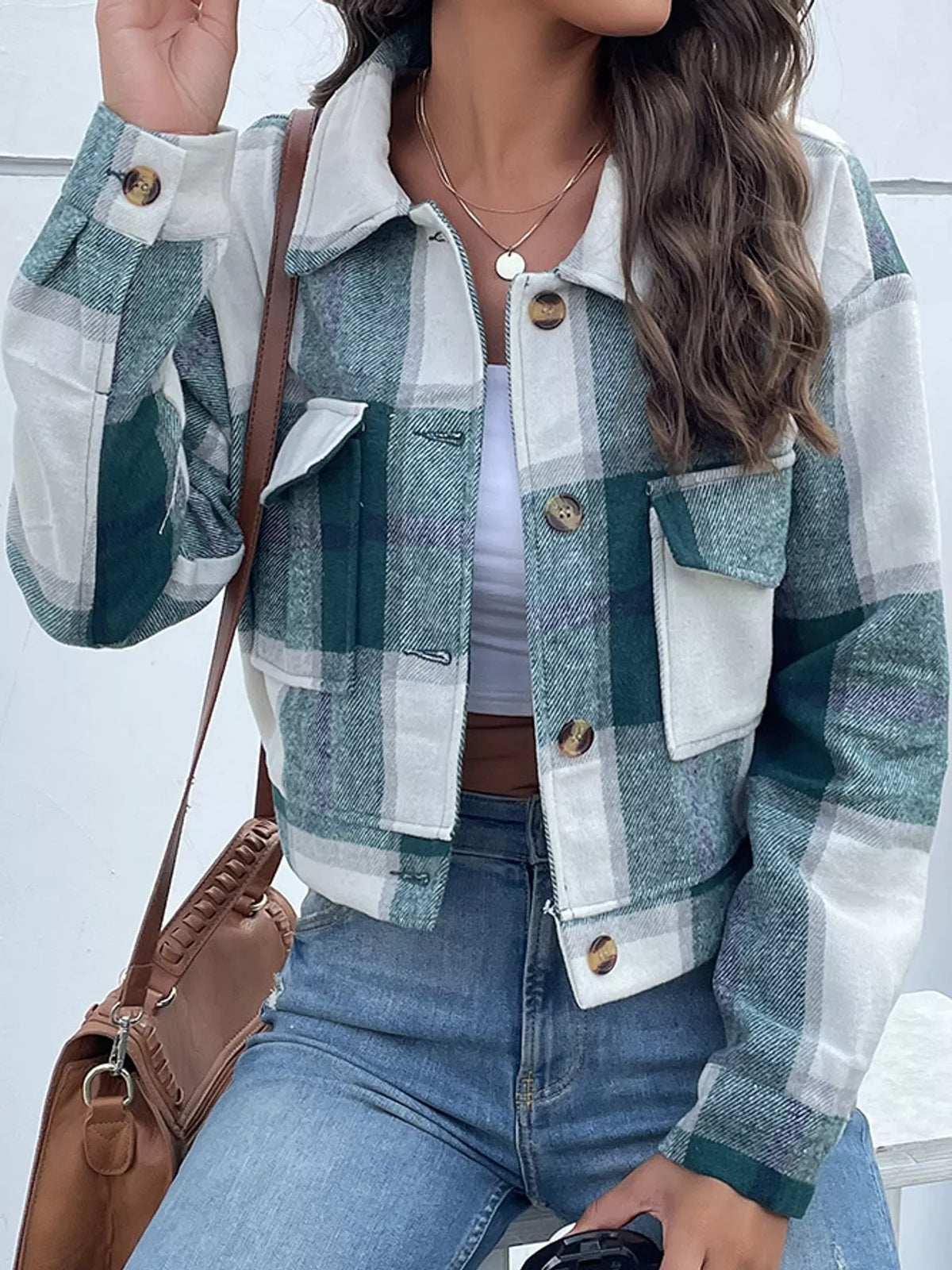 Green color-block plaid cropped jacket with flap chest pockets, front view.