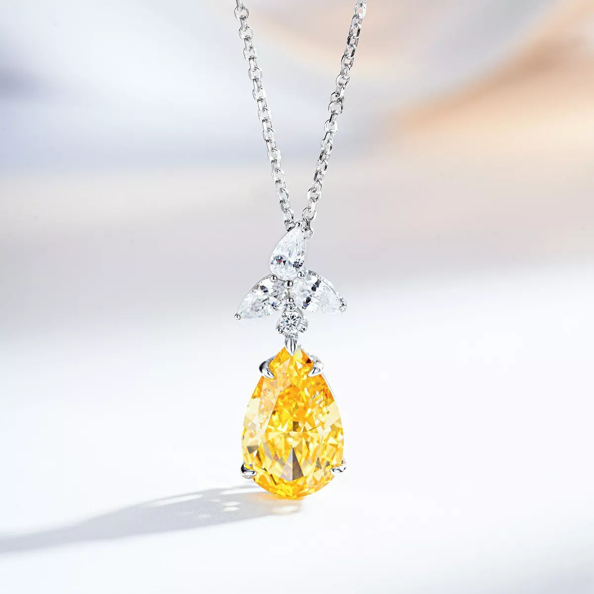 Yellow teardrop pendant necklace — detail view