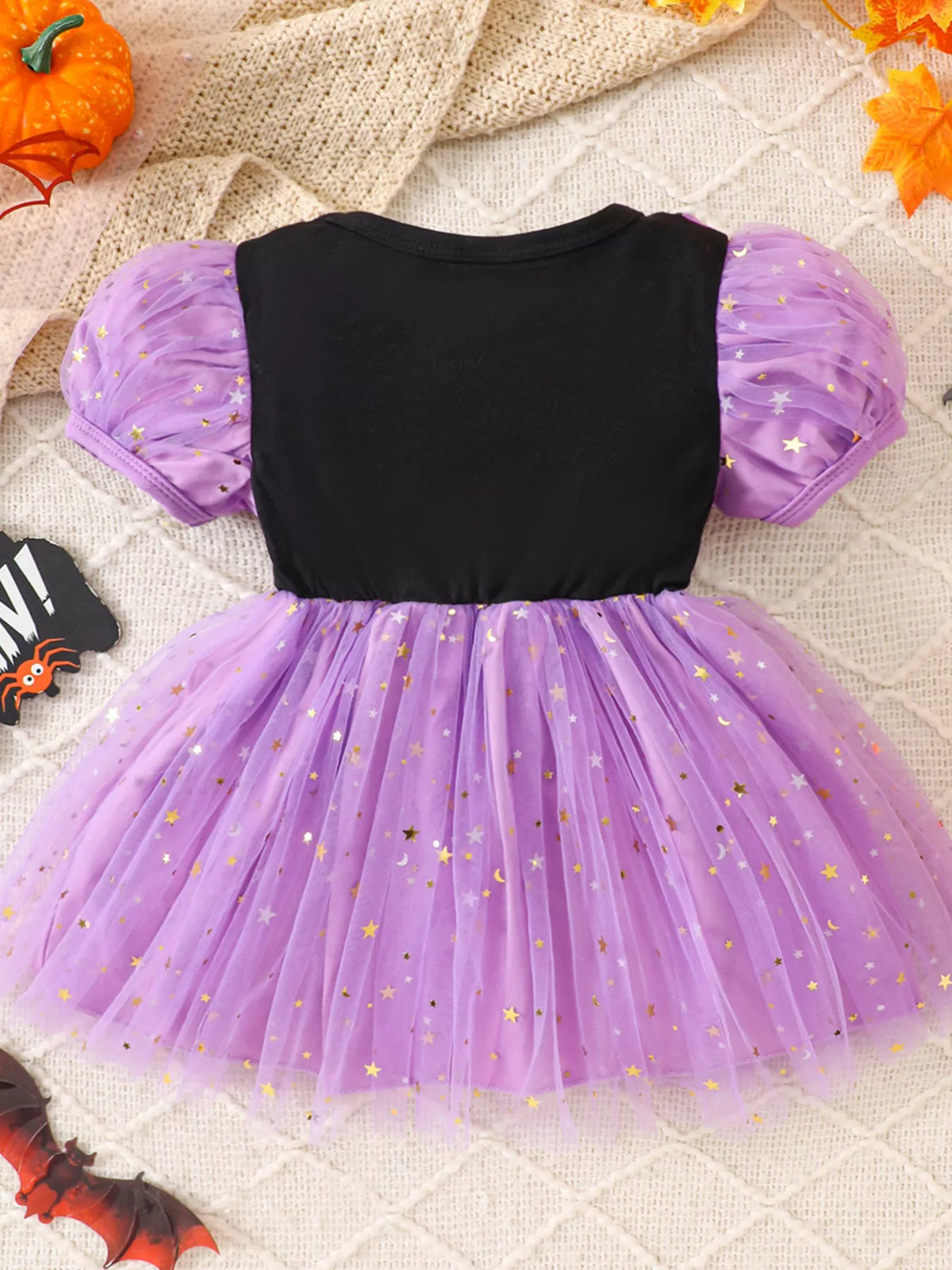 Back view of the black and purple starry tulle Halloween dress.