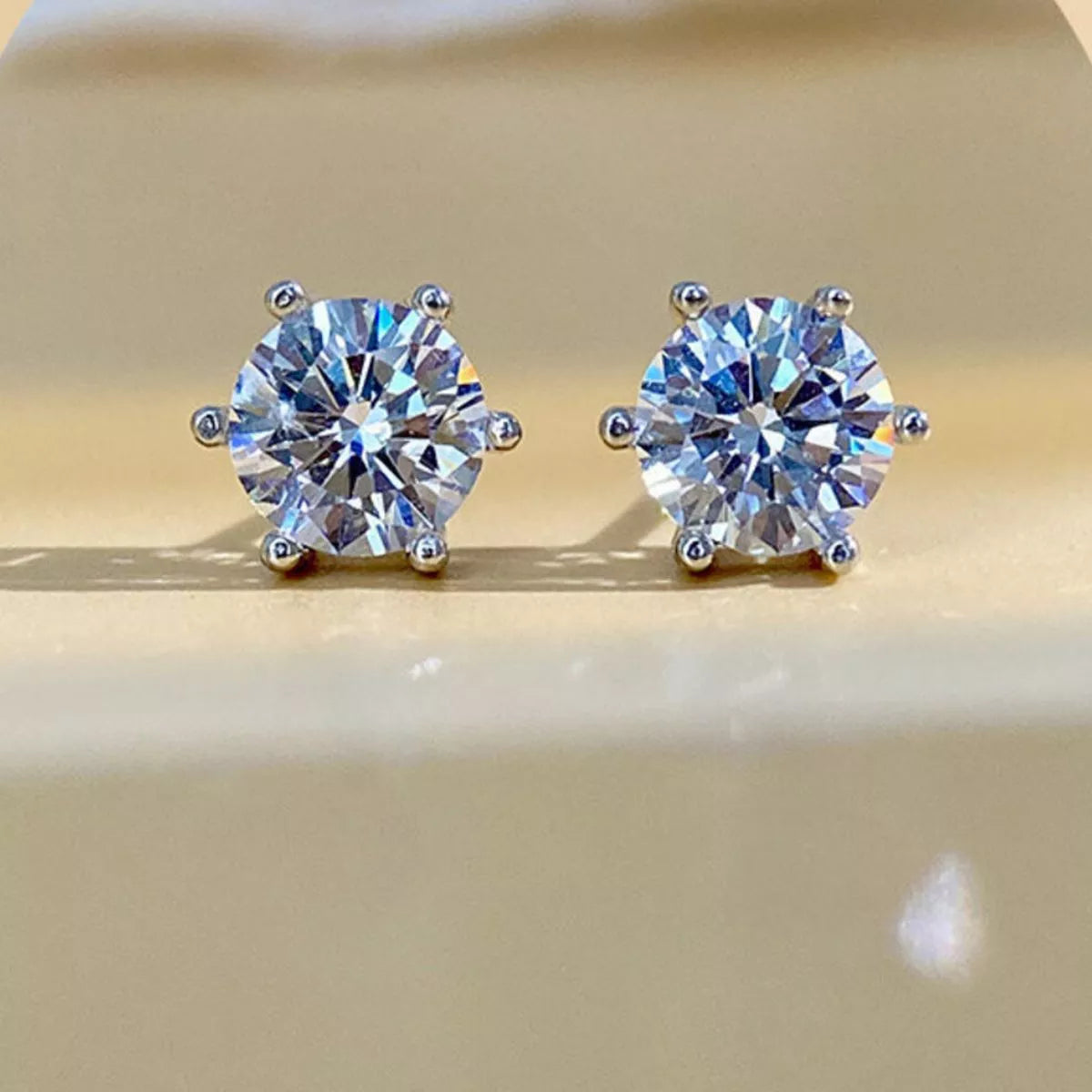 Silver-tone round clear stone stud earrings — detail view