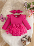 Hot pink ribbed long-sleeve baby bodysuit with bow, ruffle trim and matching headband displayed flat