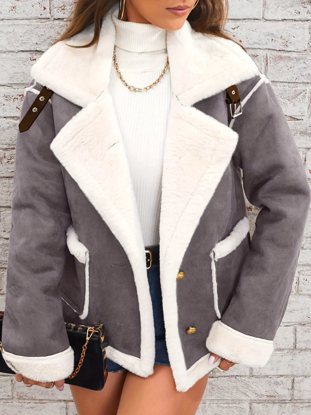 Dark-gray jacket with wide white plush lapels, contrast trim and front pockets, front view.