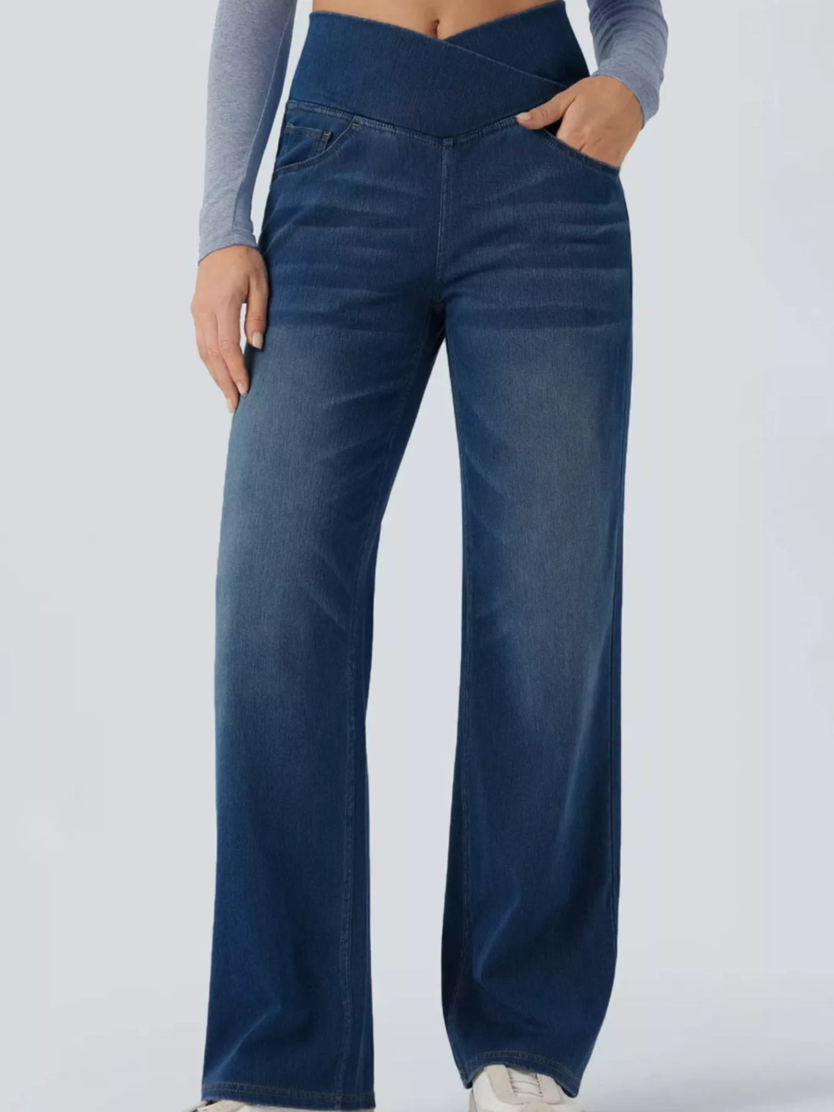 Dark blue high-waisted crossover waistband straight-leg jeans — detail view