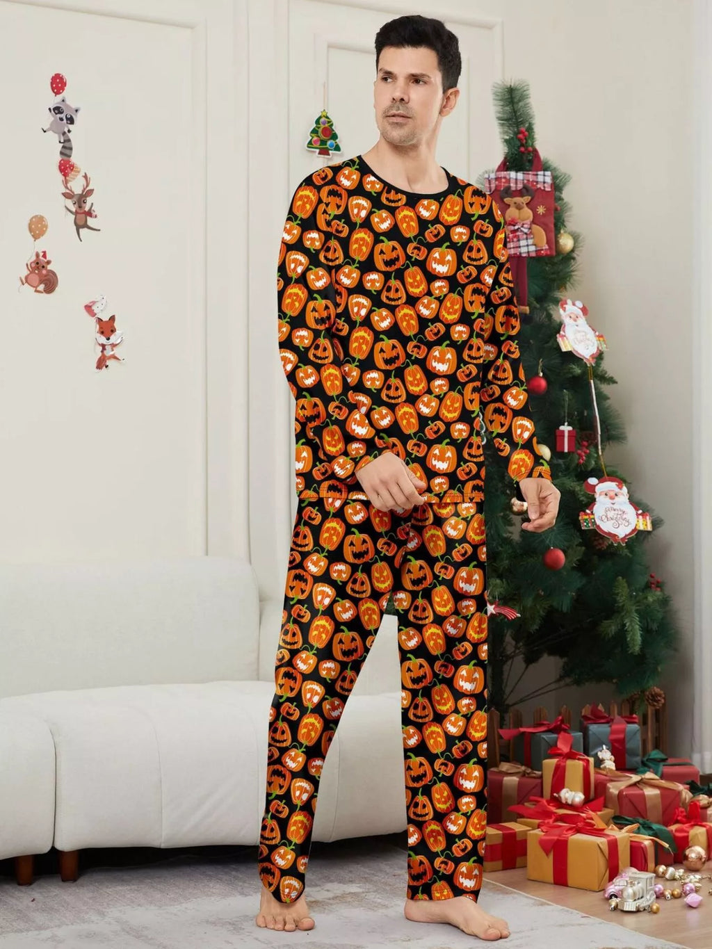 Front view of the men's black and orange pumpkin-print pajamas.
