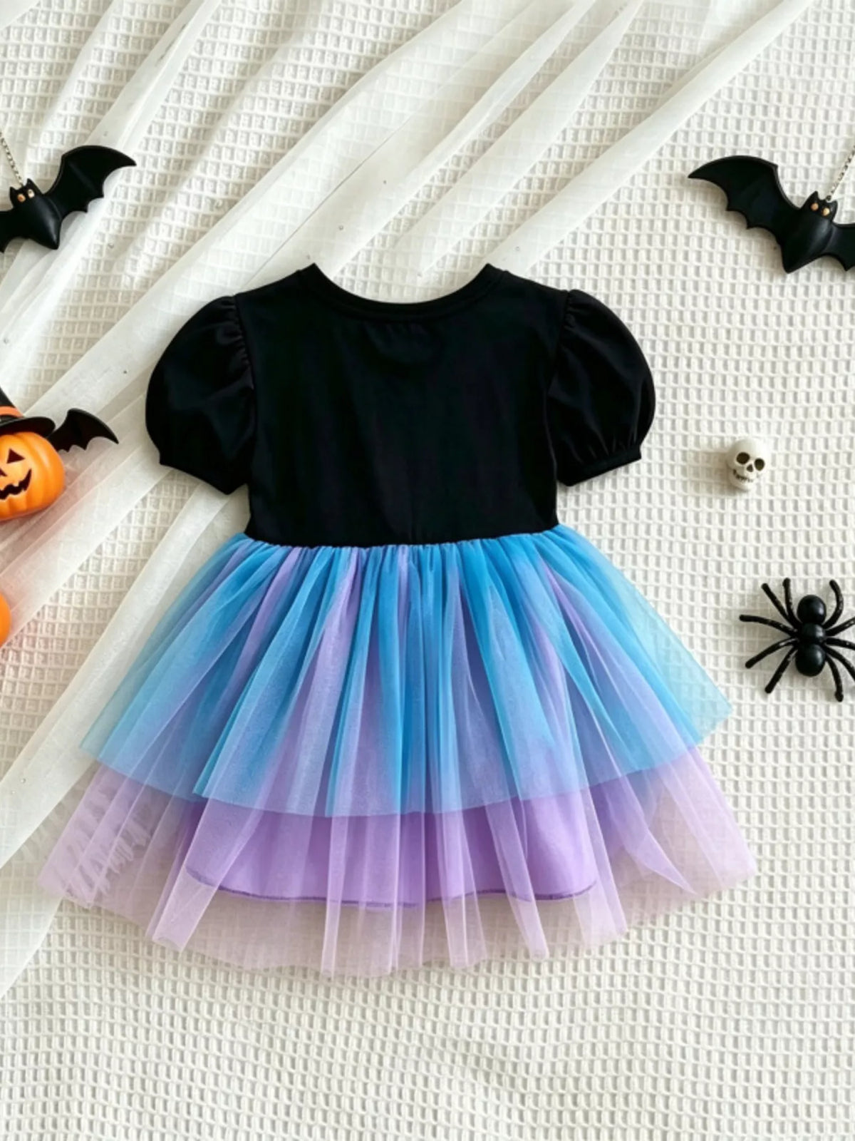 Back view of the black skeleton dress with blue-and-purple tulle skirt.