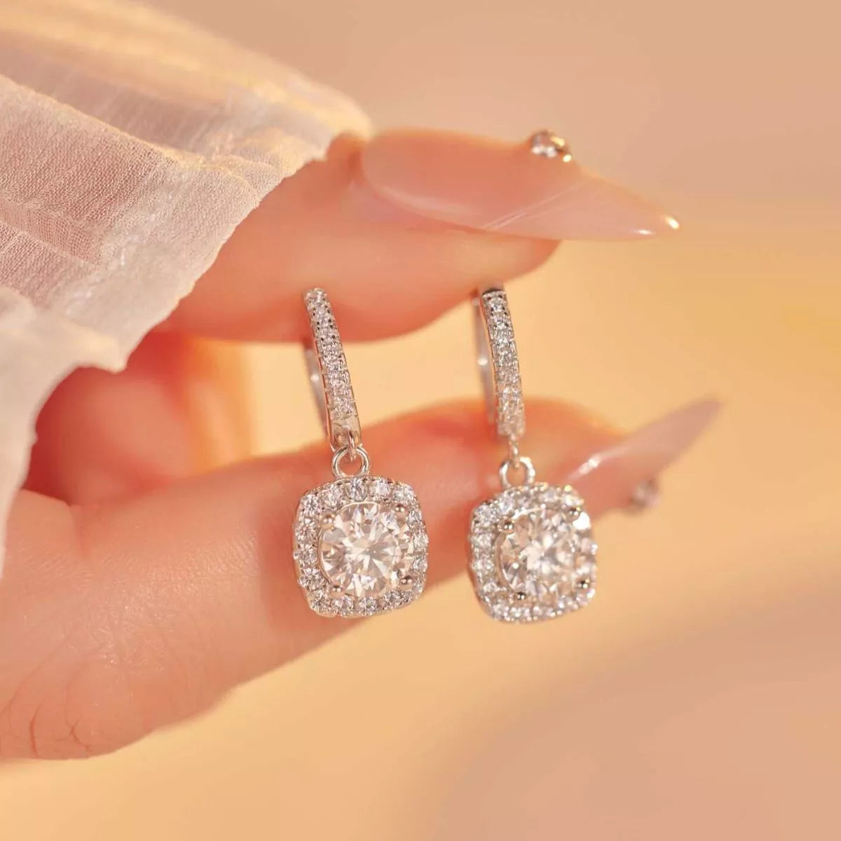 Silver-tone hoop earrings with square halo stone drops — detail view