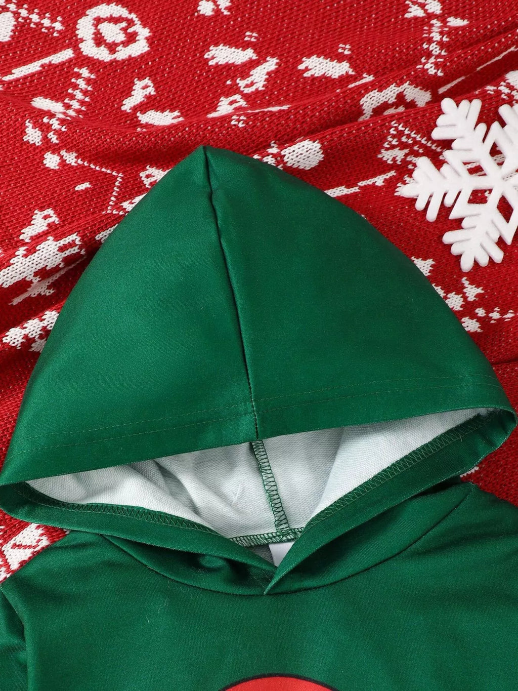 Green sweatshirt hood with white lining