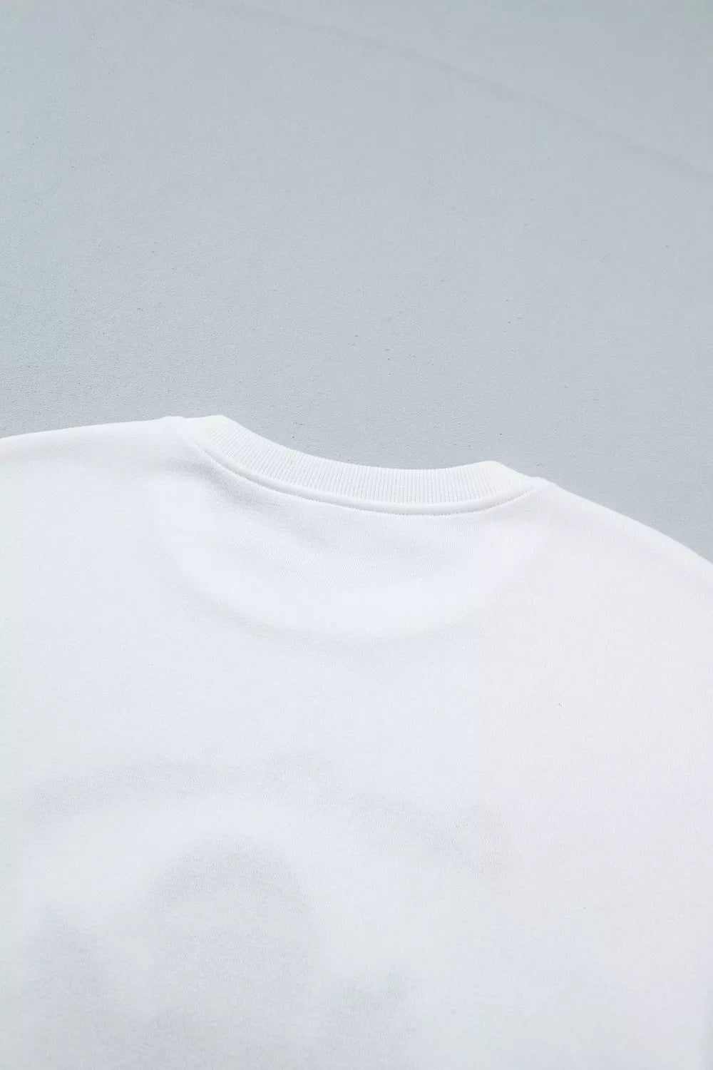 White embroidered Gingerbread Cozy Christmas Long Sleeve Round Neck Sweatshirt — detail view