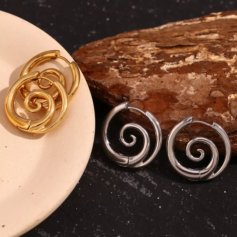Spiral hoop earrings in gold-tone and silver-tone finishes — detail view