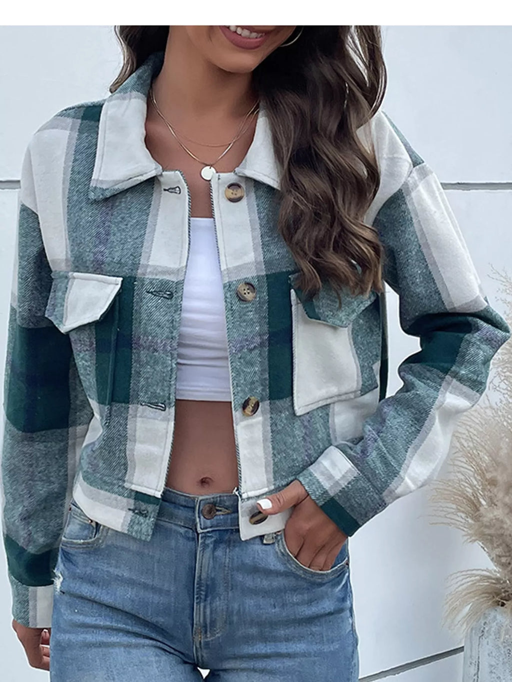 Green color-block plaid cropped jacket with flap chest pockets, front view.