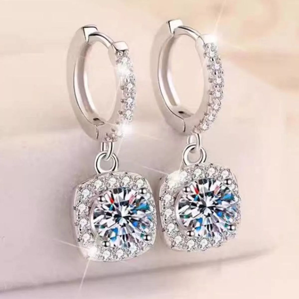 Silver-tone hoop earrings with square halo stone drops — detail view