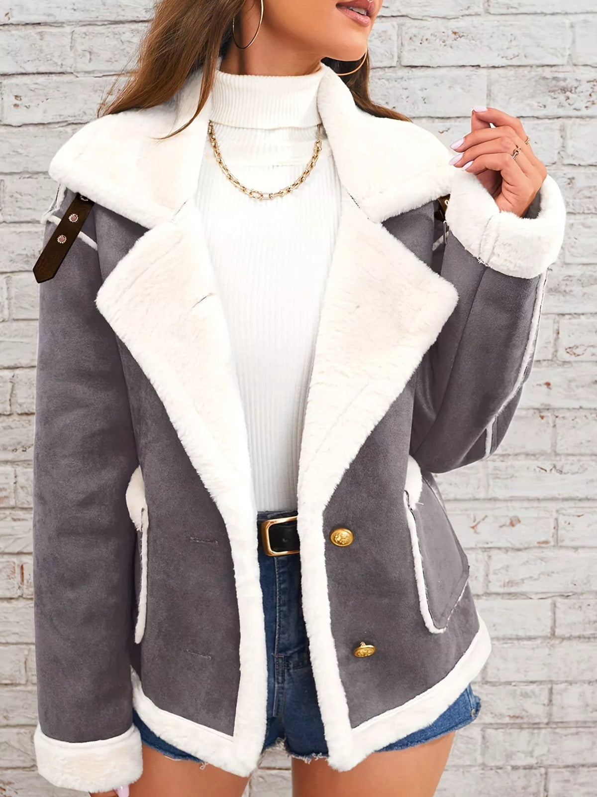 Dark-gray jacket with wide white plush lapels, contrast trim and front pockets, front view modeled worn open.