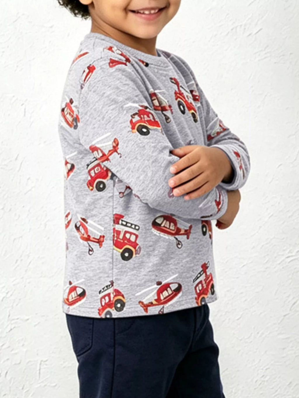 Side view of the gray fire truck and helicopter print long-sleeve shirt.