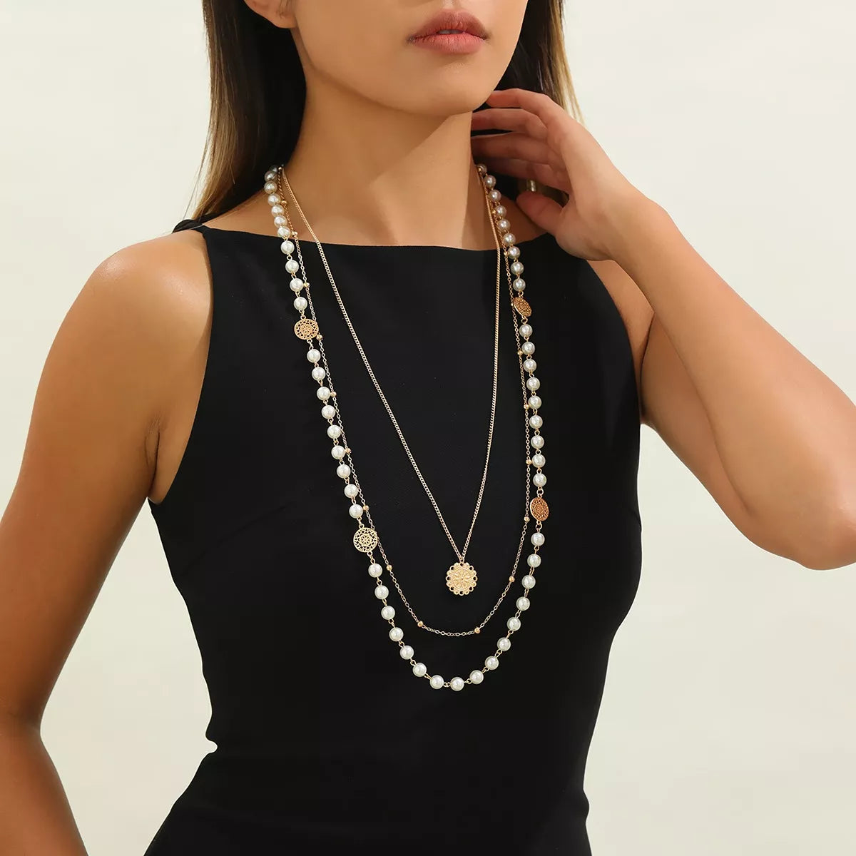 Layered pearl-like bead and coin pendant necklace