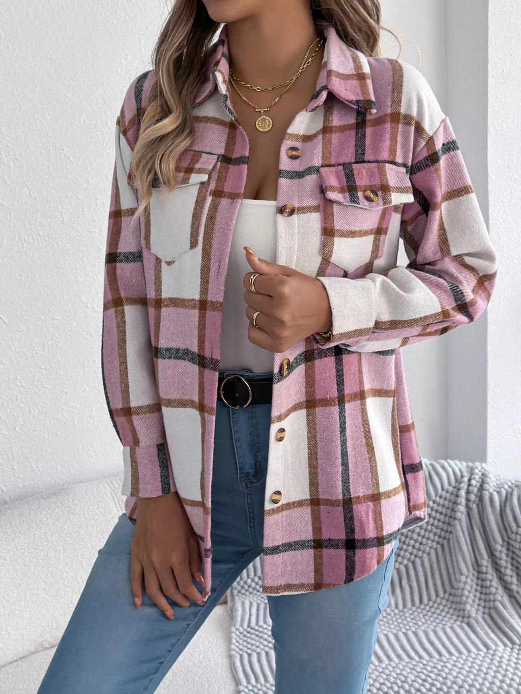 Pink plaid button-down shacket with chest pockets, front view.
