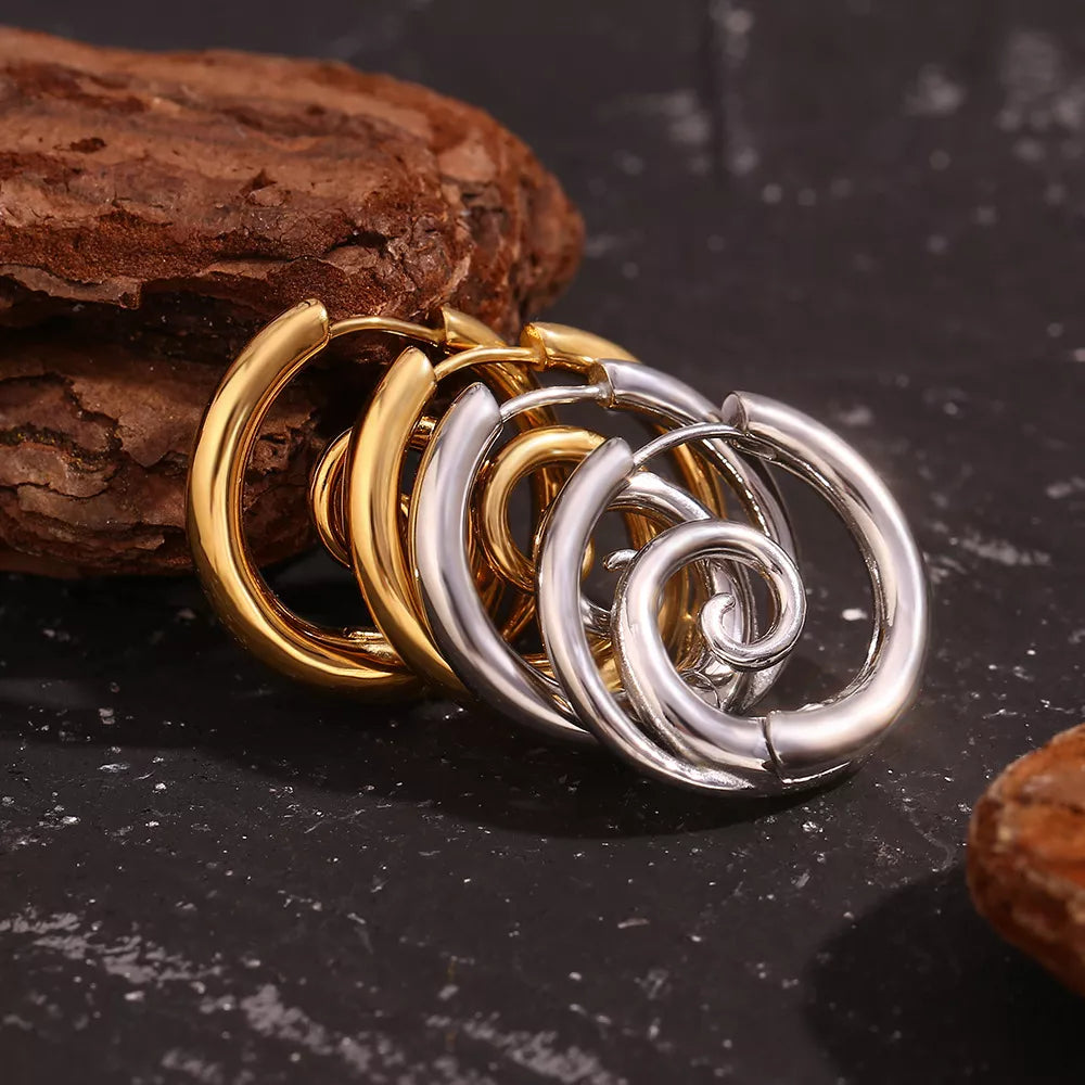 Spiral hoop earrings in gold-tone and silver-tone finishes — detail view