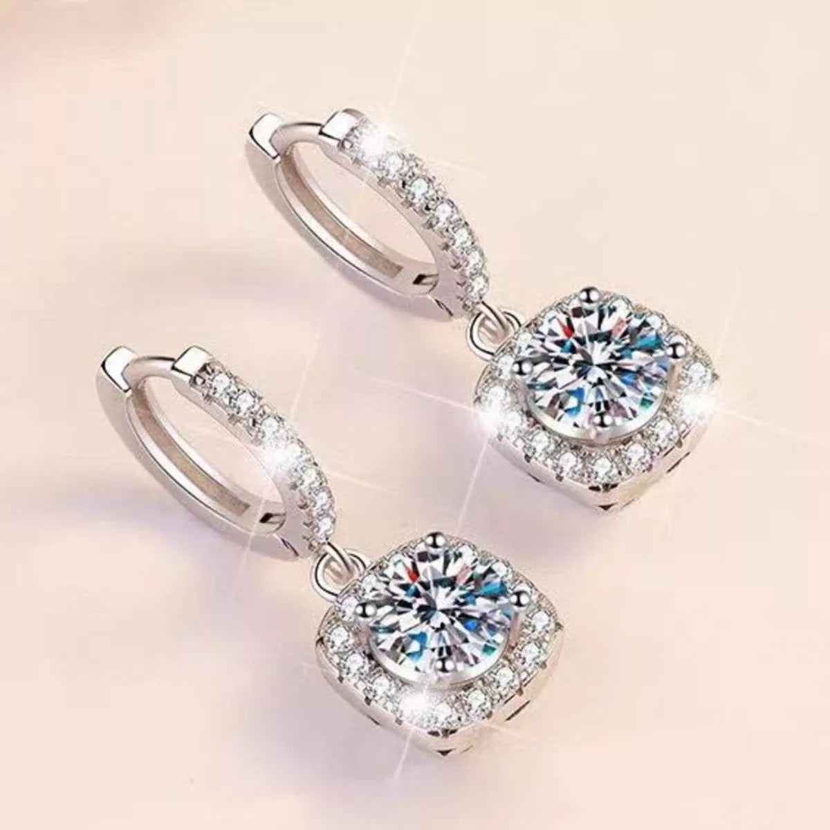 Silver-tone hoop earrings with square halo stone drops — detail view