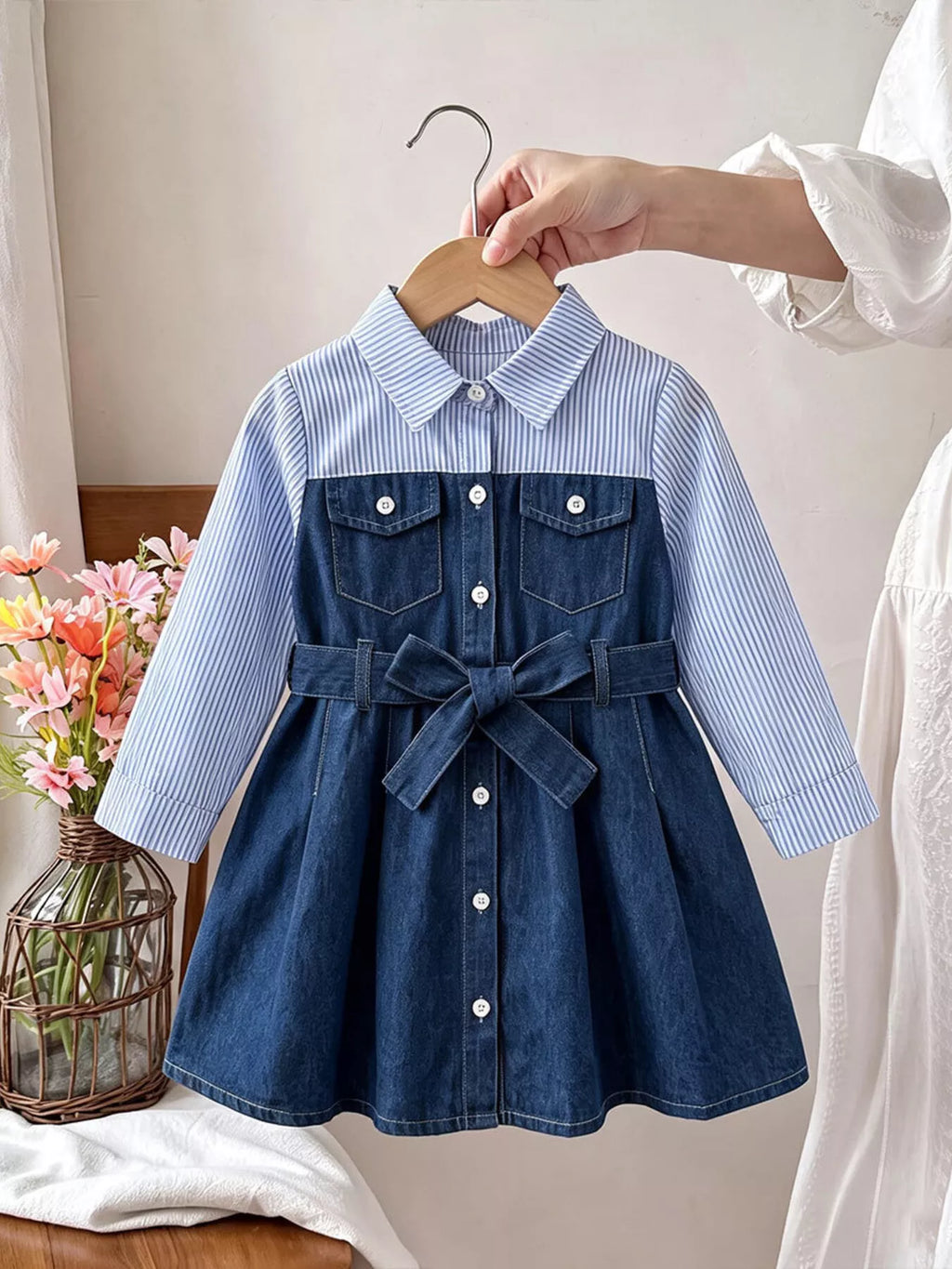 Children's blue button-front dress with striped collar and sleeves, denim-style skirt and waist tie.