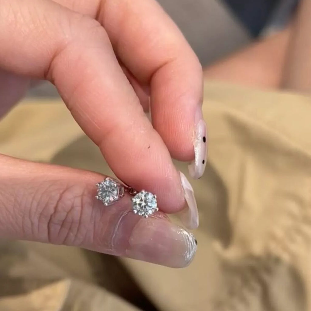 Silver-tone round clear stone stud earrings — detail view