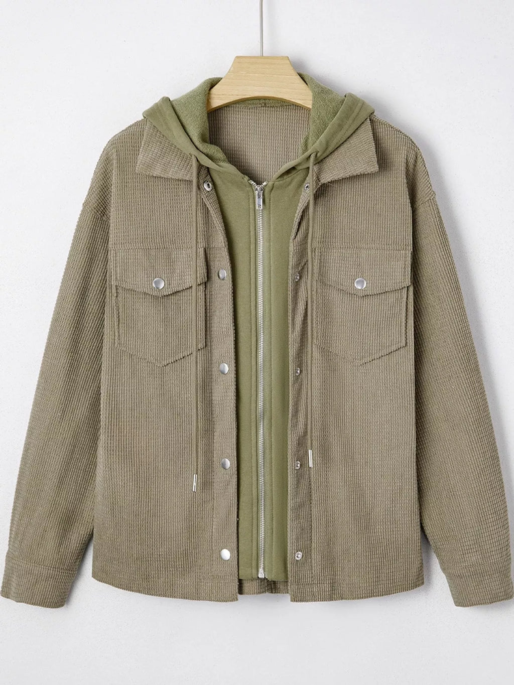 Matcha-green textured hooded jacket displayed on a hanger.