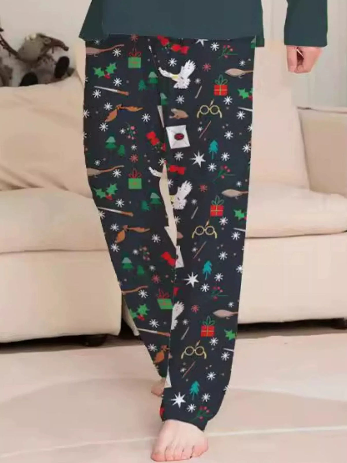 Black pajama pants with colorful magical-themed print