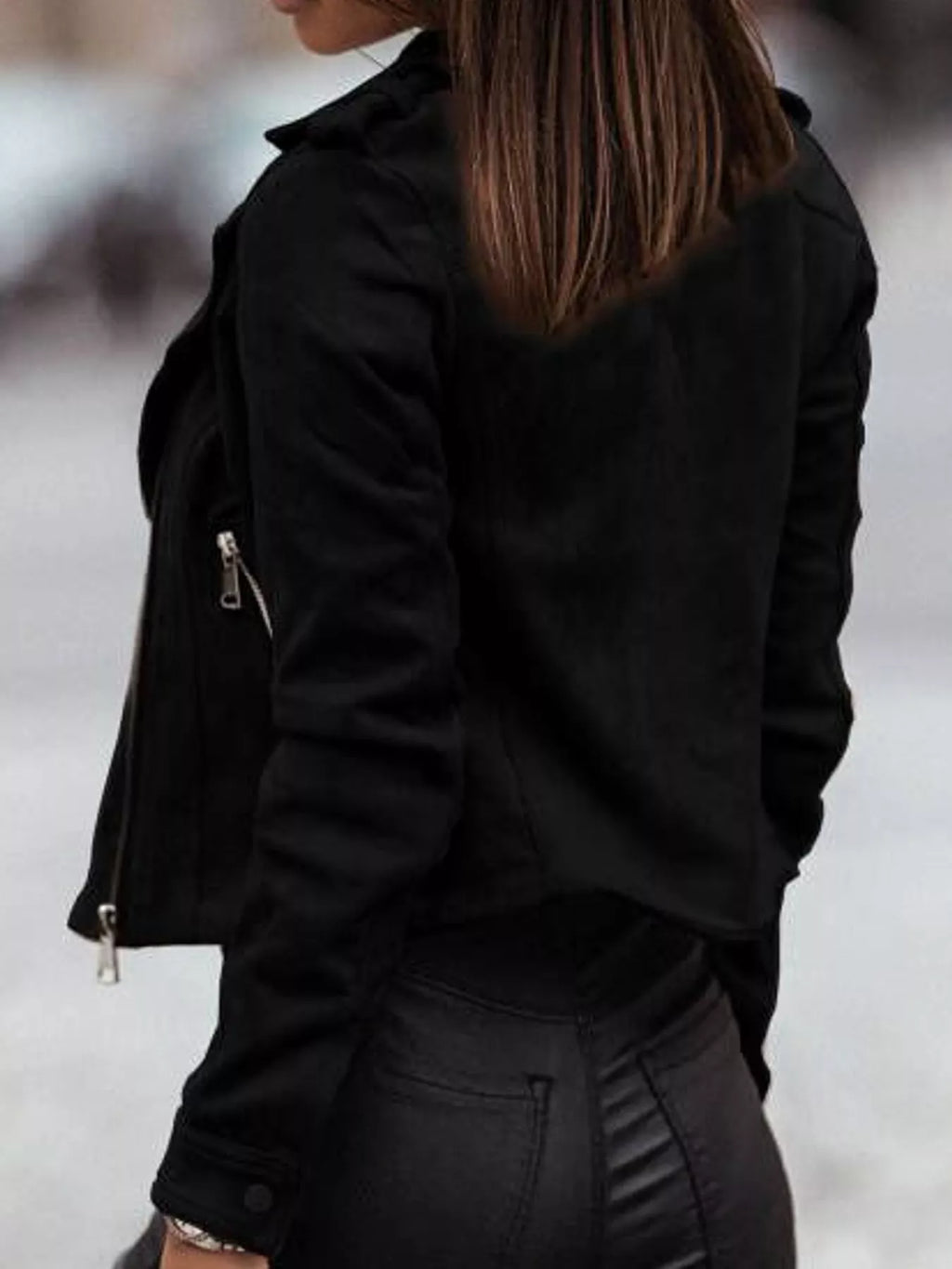 Back view of the black asymmetrical-zip jacket.