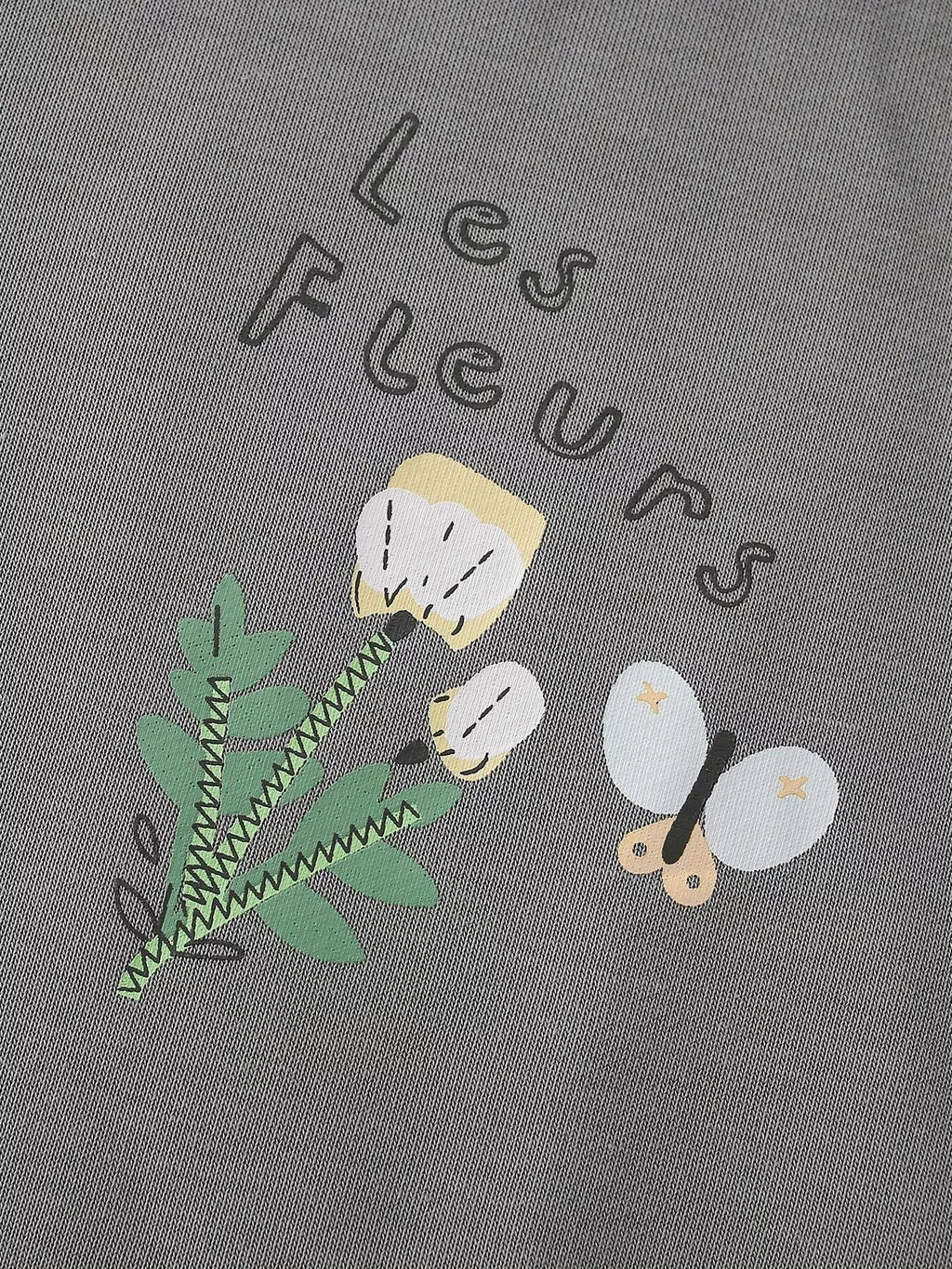Les Fleurs lettering and small flower graphics on the gray sweatshirt