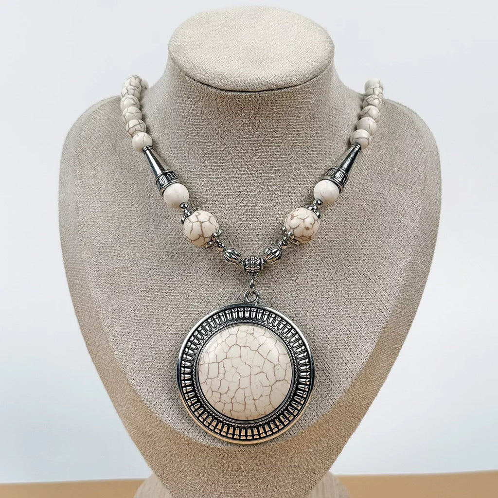 Round medallion pendant necklace with large beads