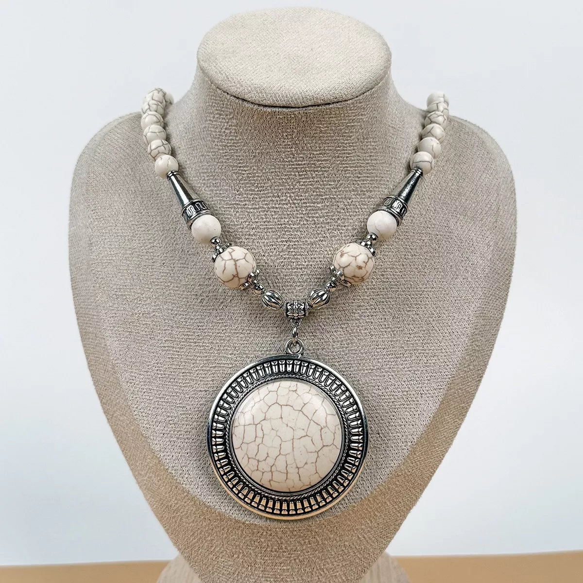 Round medallion pendant necklace with large beads